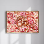 Decorative wall art with a floral background and central Om symbol on a light gray wall.