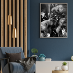 Modern living room with a blue armchair, framed black and white elephant artwork on the wall, and decorative elements.