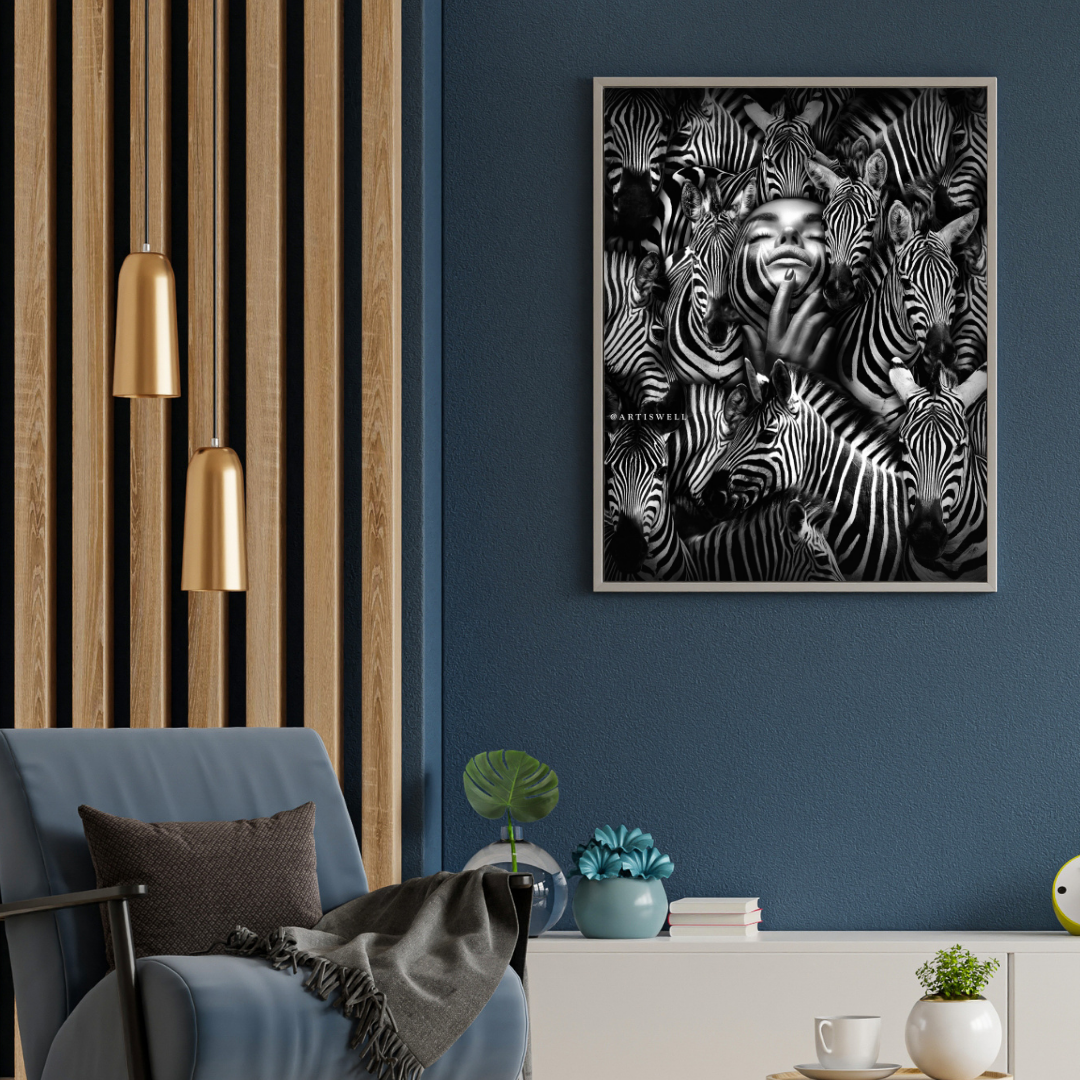 Living room with a blue armchair, gold pendant lights, and a wall art piece of zebras by dekozi.