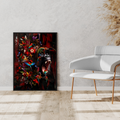 Abstract painting of gorilla and parrots by dekozi on a wall next to a modern white chair with gold legs.