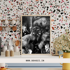 Framed black and white artwork of elephants on a decorative wall with a colorful terrazzo pattern.