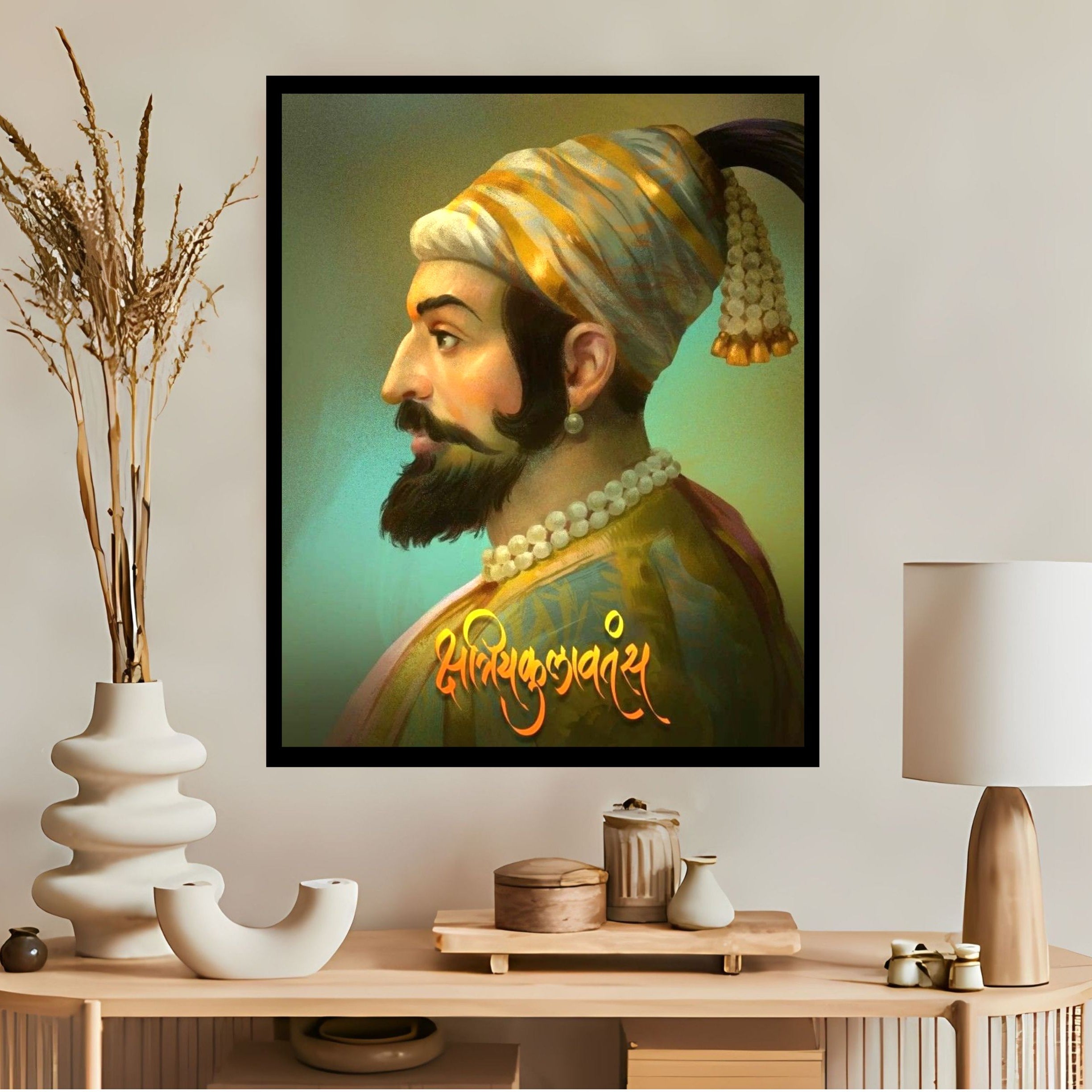 Framed portrait of chhatrapati shivaji maharaj on a wall above a wooden console table with decorative items.